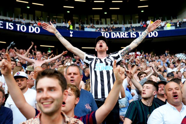 Newcastle fans celebrate their surprise win at Tottenham