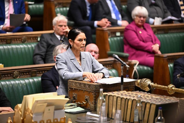 Dame Priti Patel at a despatch box speaking in the Commons
