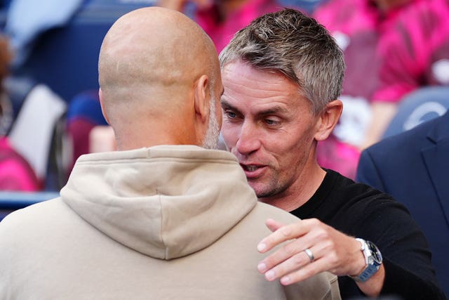 Ipswich manager Kieran McKenna and City''s Pep Guardiola embrace