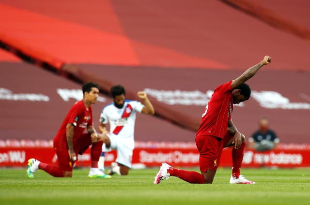 Liverpool and Crystal Palace players take the knee before their Premier League match on June 24