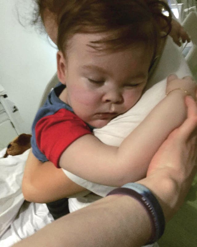 Alfie Evans cuddling his mother Kate James at Alder Hey Hospital (Family handout/Alfies Army/PA)