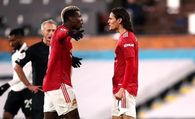 Manchester United midfielder Paul Pogba celebrates with Edinson Cavani