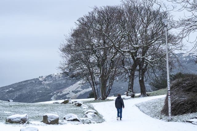 A person walking through snow