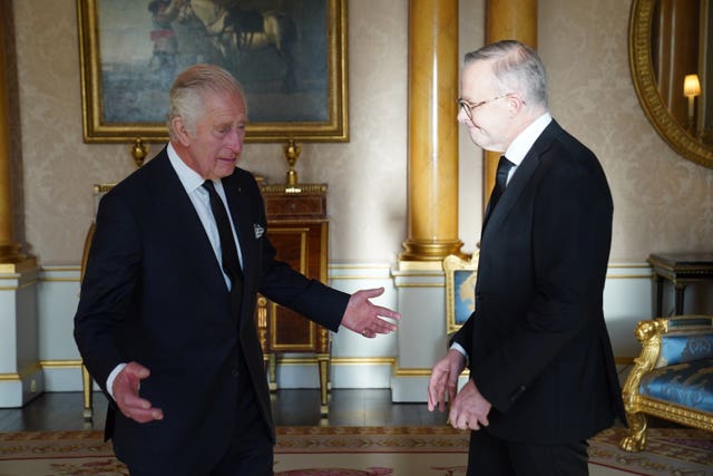 King Charles III speaks with Prime Minister of Australia, Anthony Albanese, as he receives realm prime ministers in the 1844 Room at Buckingham Palace in London on September 17, 2022