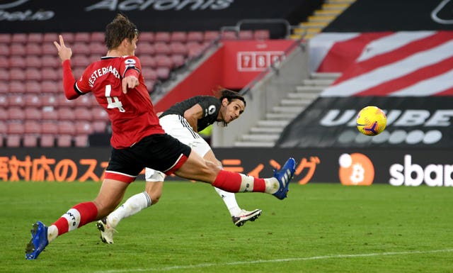 Cavani (right) scored two headed goals after setting up  Fernandes for the opener