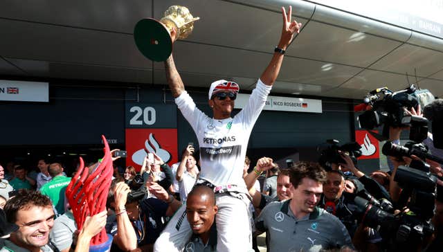 Lewis Hamilton celebrates after ending his wait for another British Grand Prix victory after triumphing in the 2014 race