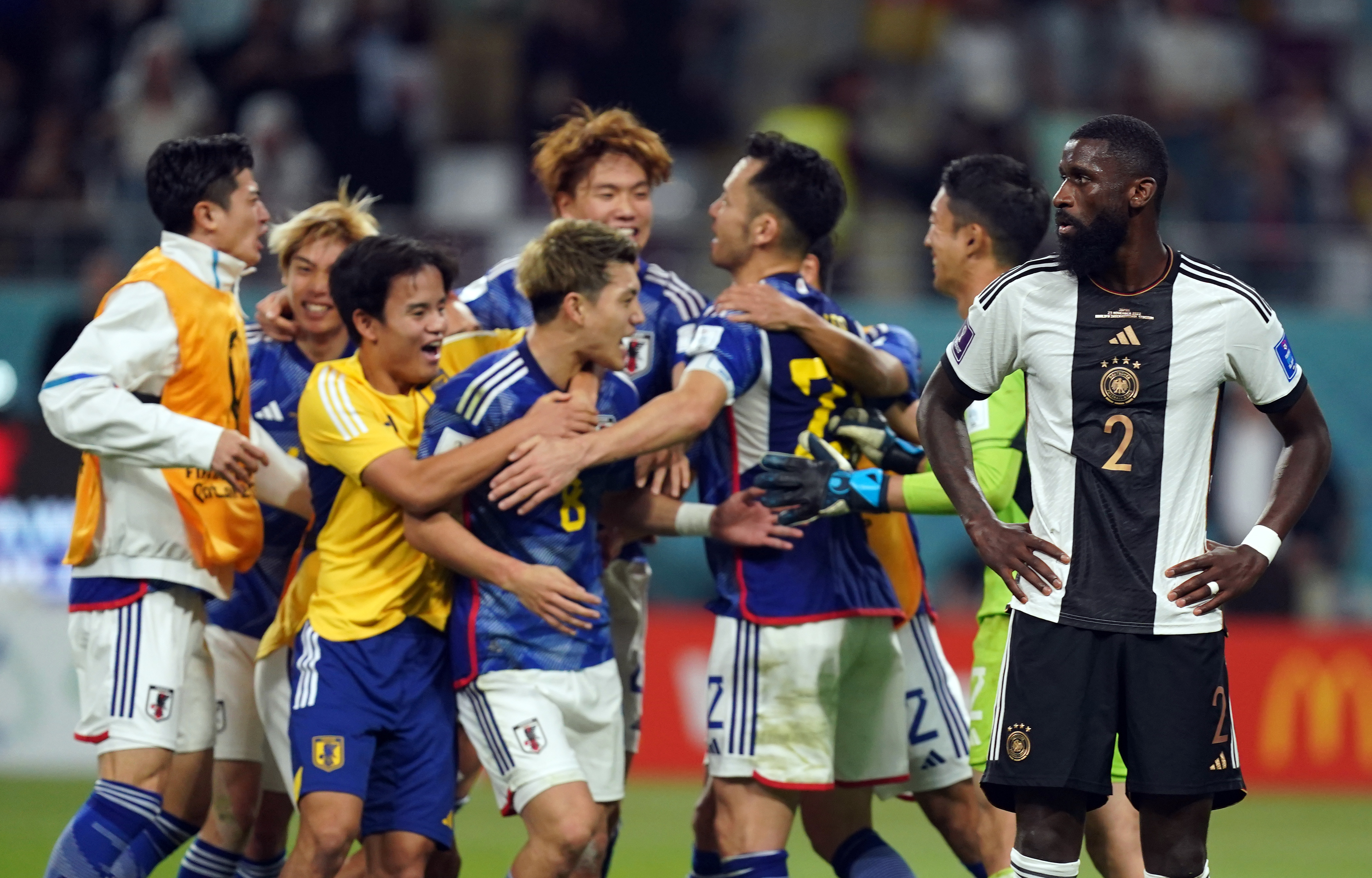 Japan players celebrate victory over at the World Cup