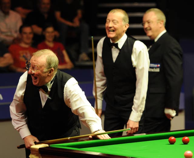 Steve Davis (centre) and Dennis Taylor break into laughter during their exhibition match recreating their 1985 final at the Crucible Theatre, Sheffield.