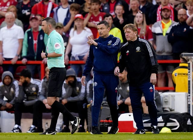 Sheffield United manager Paul Heckingbottom is booked by the referee 