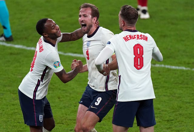 Raheem Sterling celebrates with Harry Kane and Jordan Henderson