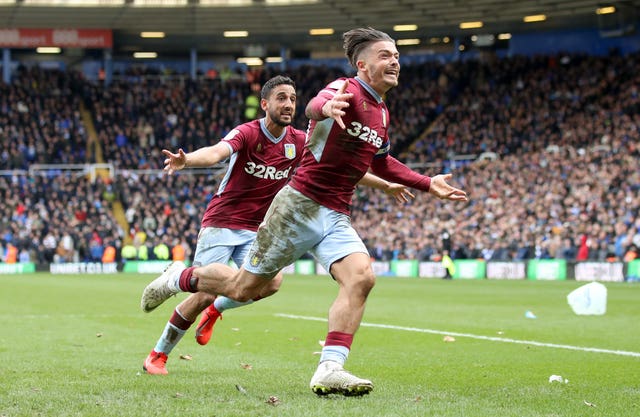 Jack Grealish celebrates scoring Villa's winner having been punched by spectator Paul Mitchell earlier in the game