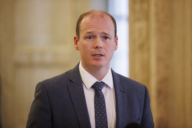 Communities Minister Gordon Lyons speaking at Stormont