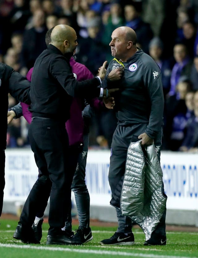 There were angry exchanges between Pep Guardiola (left) and Paul Cook