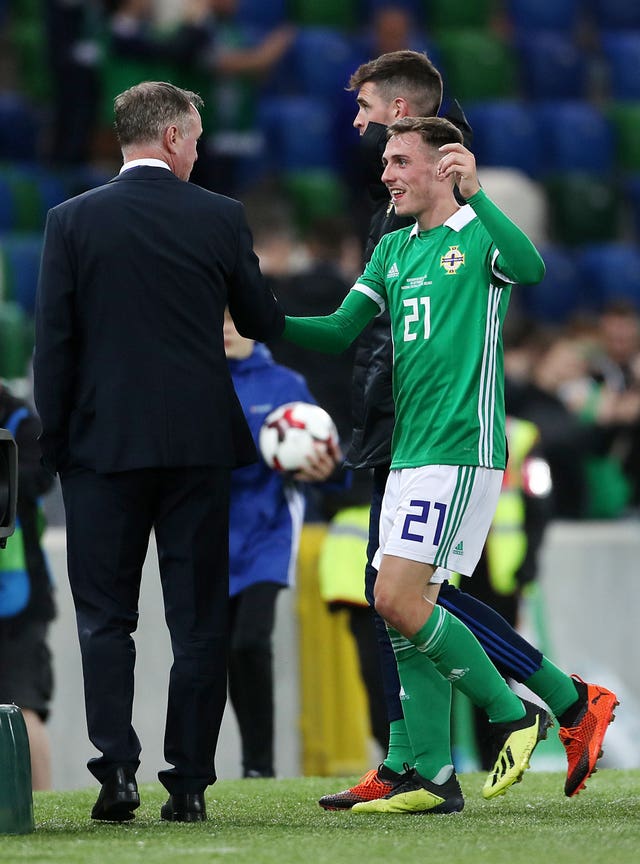 Northern Ireland manager Michael O’Neill congratulates Gavin Whyte on his debut goal (Liam McBurney/PA).