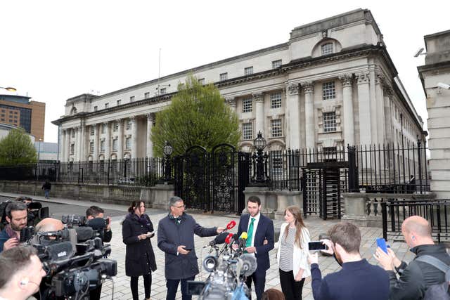 Daniel Mcarthur and his wife Amy face media outside the court (Brian Lawless/PA)