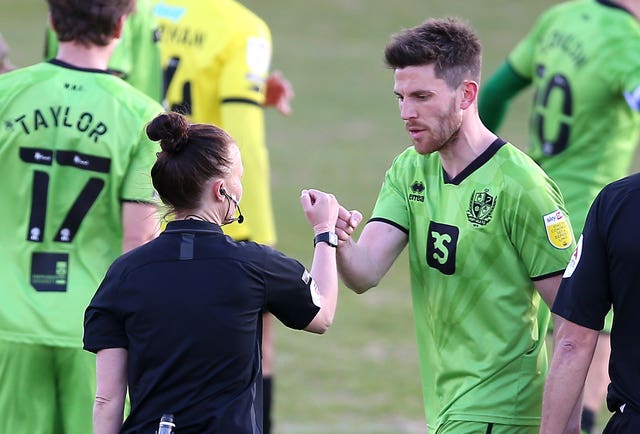 Welch, pictured with Port Vale's Shaun Brisley, was congratulated by all the players after Monday's Sky Bet League Two match at Harrogate