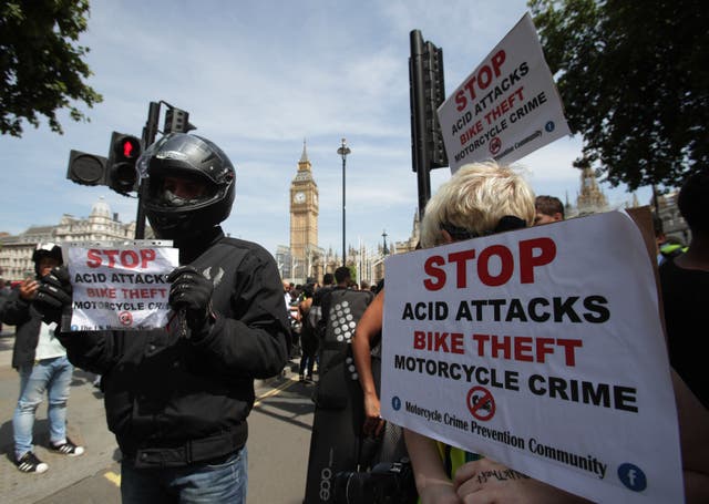Food delivery riders demonstrated in Parliament Square following moped acid attacks after five separate male victims were targeted in the north and east of the capital (Yui Mok/PA)
