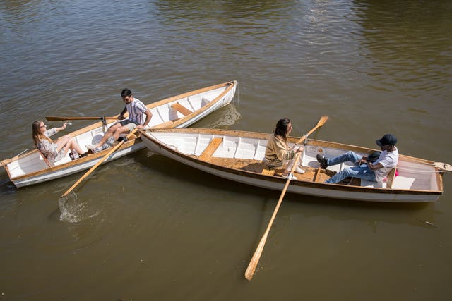 People take boat rides on the river Avon