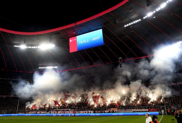 Bayern fans let off smoke flares in the stands 