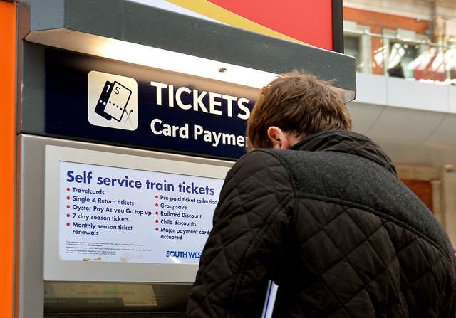 Train passenger buying their tickets