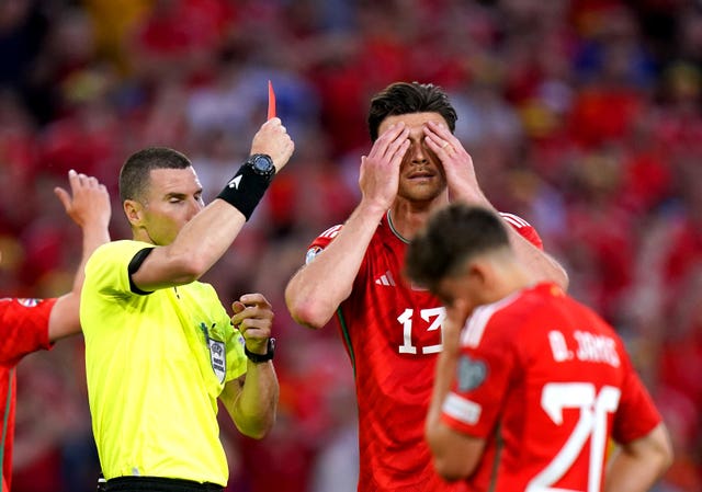 Kieffer Moore (right) is sent off for Wales
