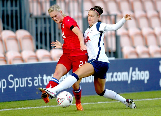 Alex Morgan, right, made her long-awaited debut for Tottenham Women - almost two months after signing - in their 1-1 draw with Reading in the Women's Super League