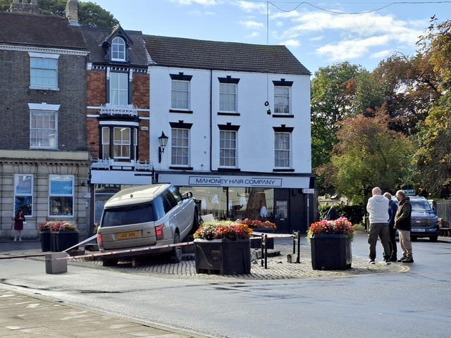 A general view of the scene where a Range Rover has mounted a paved area and knocked down the Market Cross in Howden, East Yorkshire