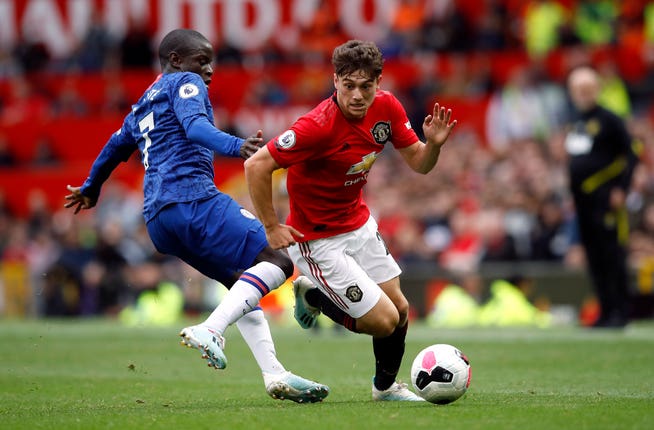 Kante (left) was only fit enough for the bench at Old Trafford
