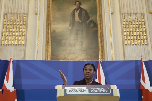 Kemi Badenoch speaking from behind a lectern