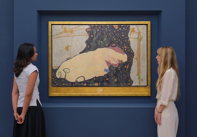 People look at an artwork by Egon Schiele