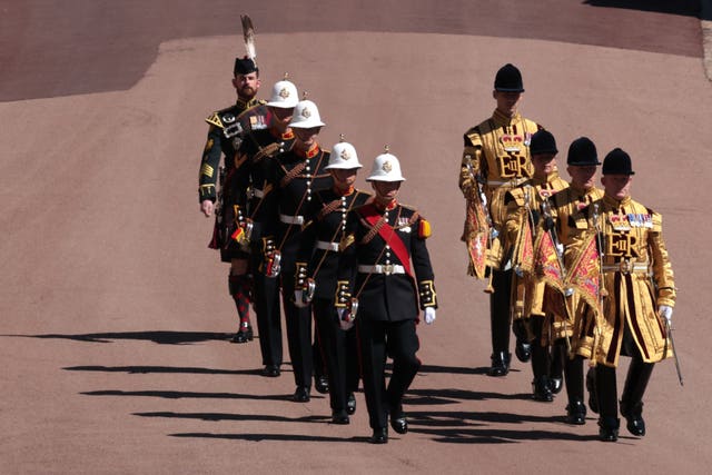 Members of the military march outside St George’s Chapel