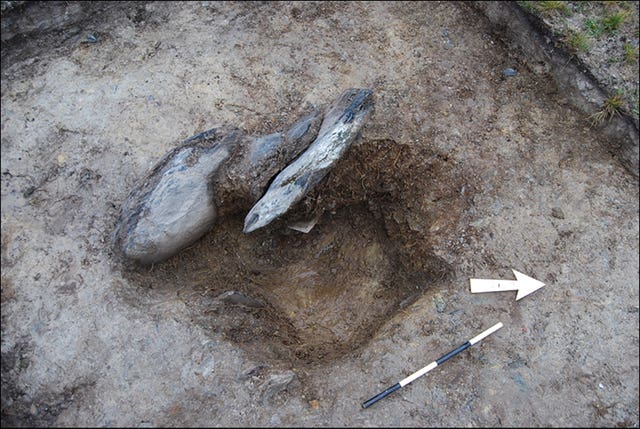 Archaeological excavation of a stonehole (Mike Parker Pearson/Antiquity Journal/PA)