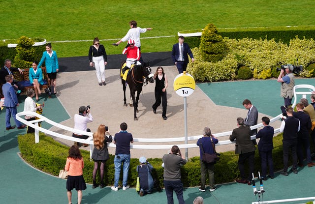 Hollie Doyle returns to the winner's enclosure with Duty First