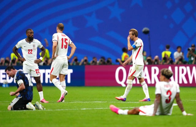 England’s Harry Kane (second right) and team-mates look dejected following defeat (Nick Potts/PA)