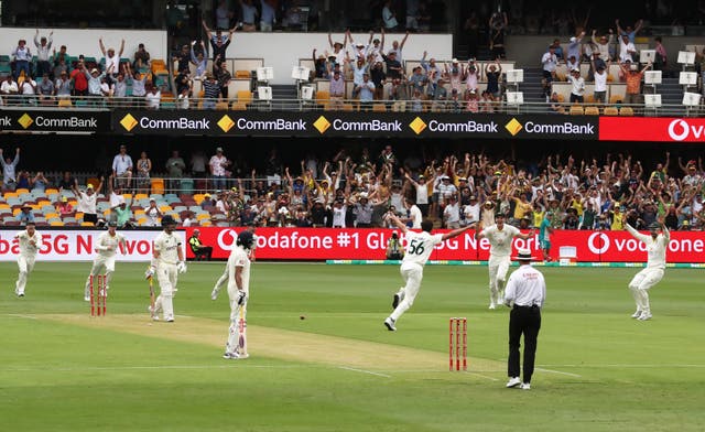 Mitchell Starc celebrates his first ball success.