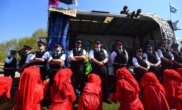 Metropolitan Police surround Extinction Rebellion demonstrators on Waterloo Bridge in London