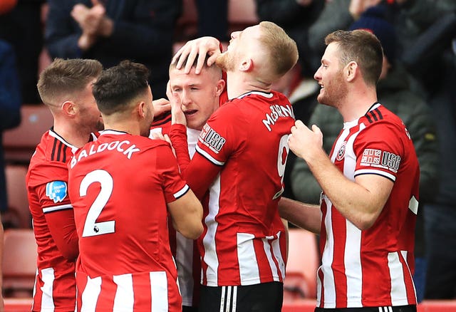 John Lundstram celebrates firing flying Sheffield United to a 2-1 comeback win against Bournemouth