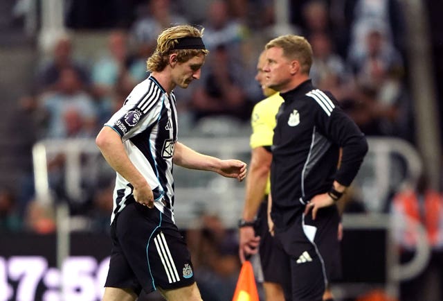 Anthony Gordon, left, walks after being shown a red card