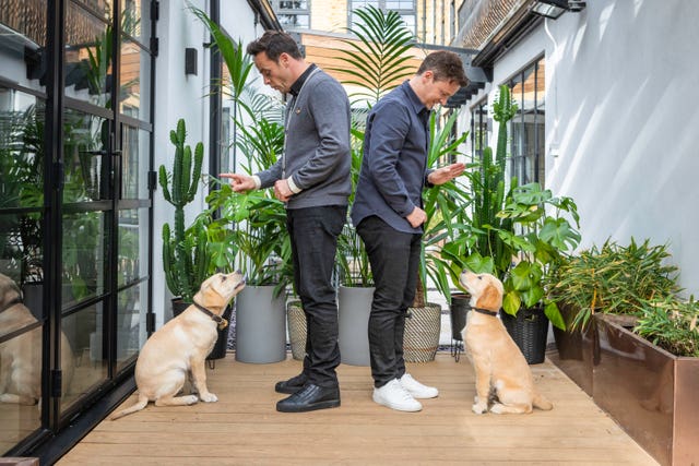 Ant and Dec with the puppies named after them