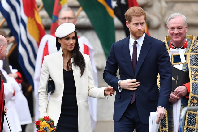 Prince Harry and Meghan Markle leave following the Commonwealth Service (Joe Giddens/PA)