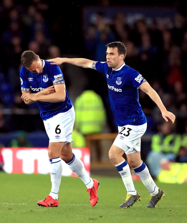 Everton's Phil Jagielka (left) is given the captain's armband by Seamus Coleman as he is substituted on during the Premier League match at Goodison Park, Liverpool 