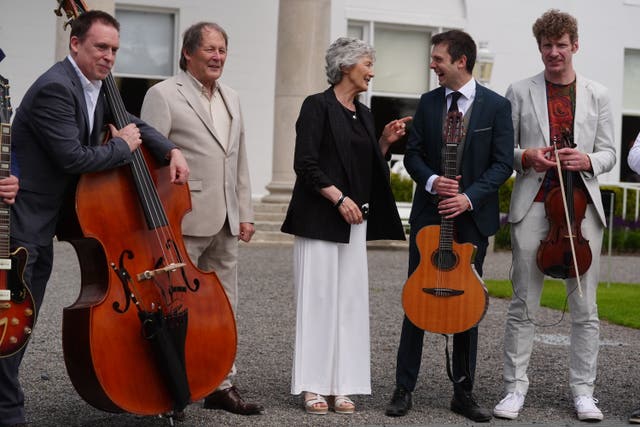 Catherine Connolly and Brian McEnery meeting performers ahead of the garden party