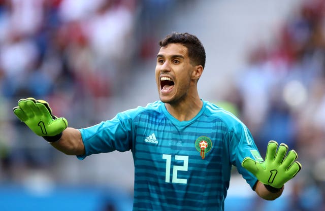 Morocco goalkeeper Mohamedi had to make a smart stop on the stroke of half-time