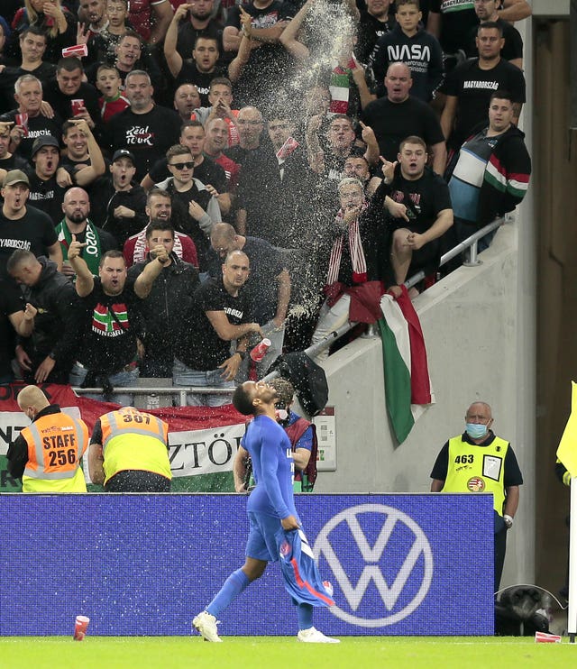 Cups are thrown at Sterling  after his goal against Hungary in Budapest