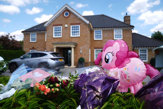 Flowers in the foreground and the house in the background