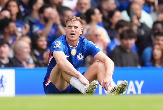 Chelsea’s Liam Delap waits for treatment after pulling up with an injury against Fulham
