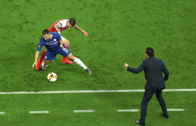 Lucas Torreira battles with Eden Hazard in front of Arsenal boss Unai Emery 