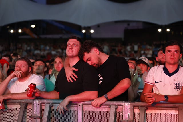 England fans appear dejected during a screening of the World Cup 2026 semi-final match between England and Argentina at Castlefield Bowl, Manchester