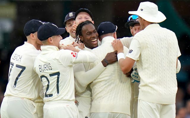 Jofra Archer, centre, was mobbed by his team-mates after dismissing Cameron Bancroft