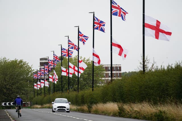 Union and St George flags hanging from lampposts in Birmingham